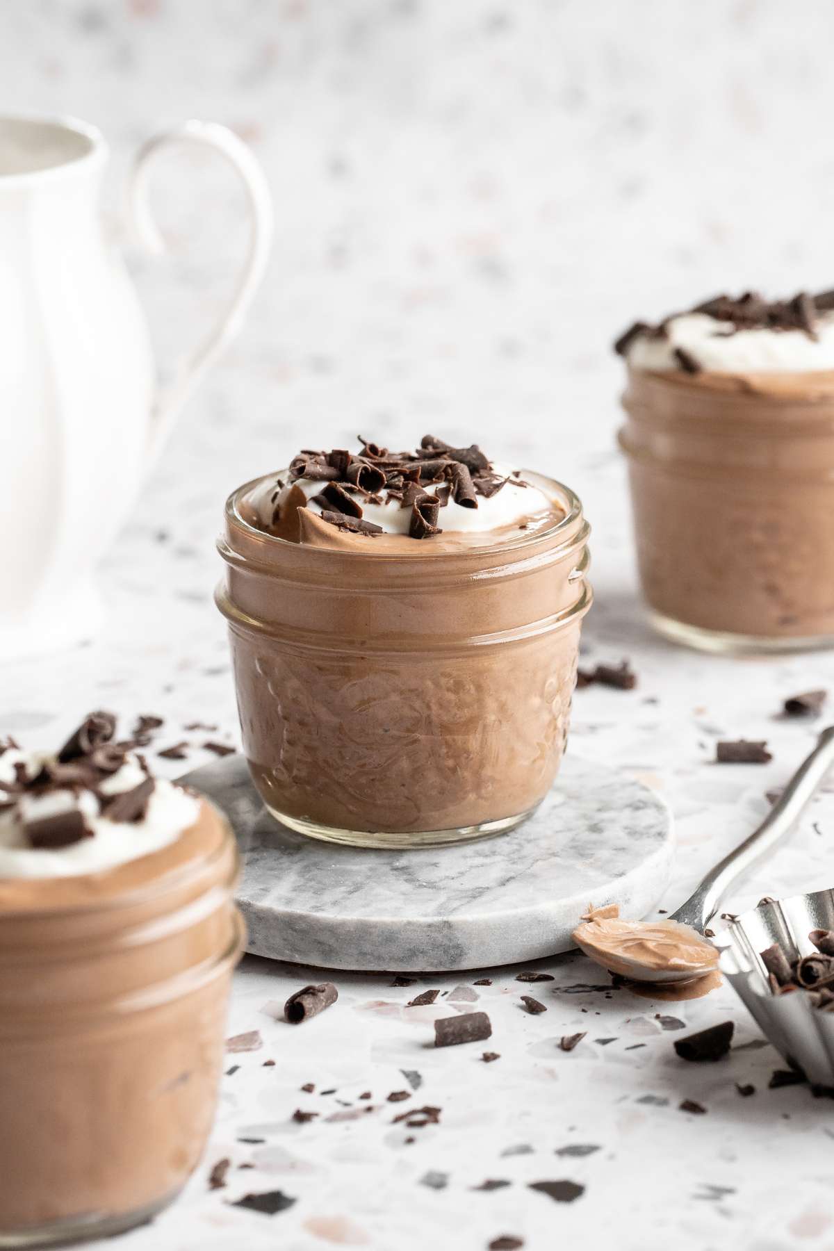 Double chocolate cottage cheese mousse topped with a dollop of greek yogurt and chocolate shavings.