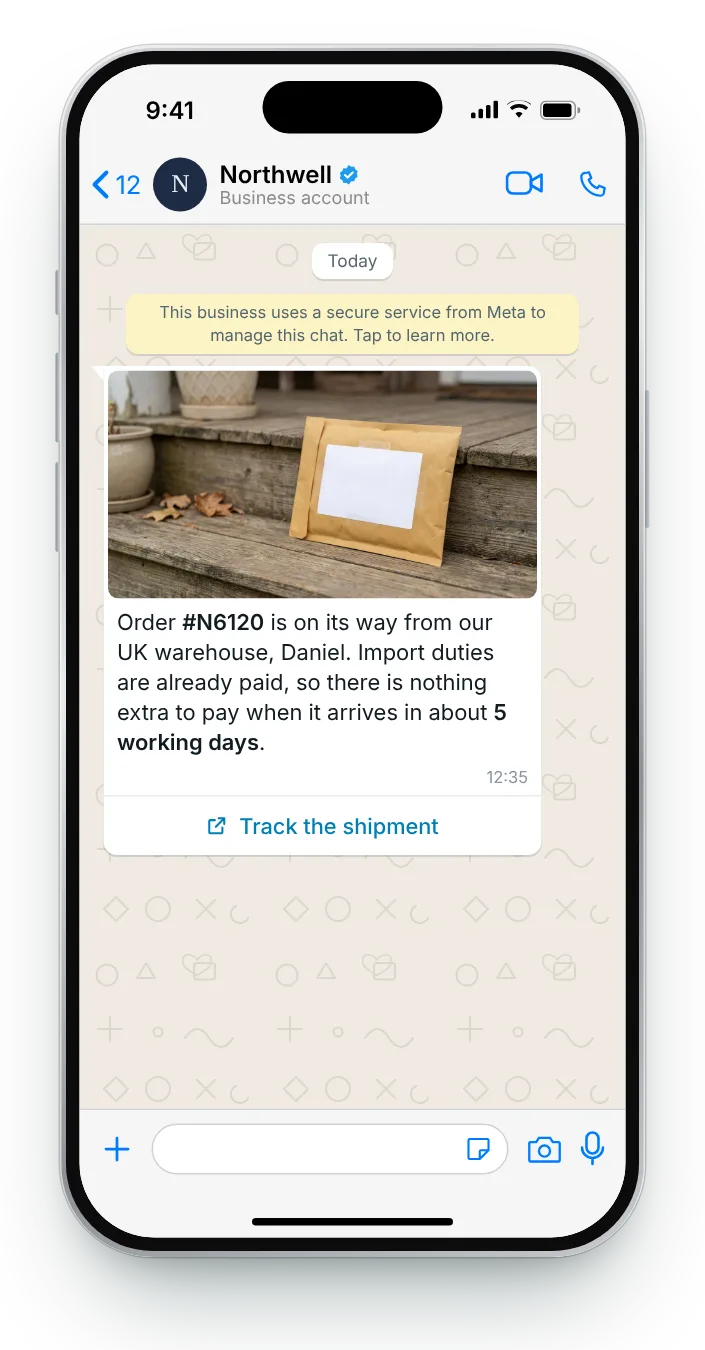 Abroad, with duties already paid: WhatsApp shipping update on an iPhone
