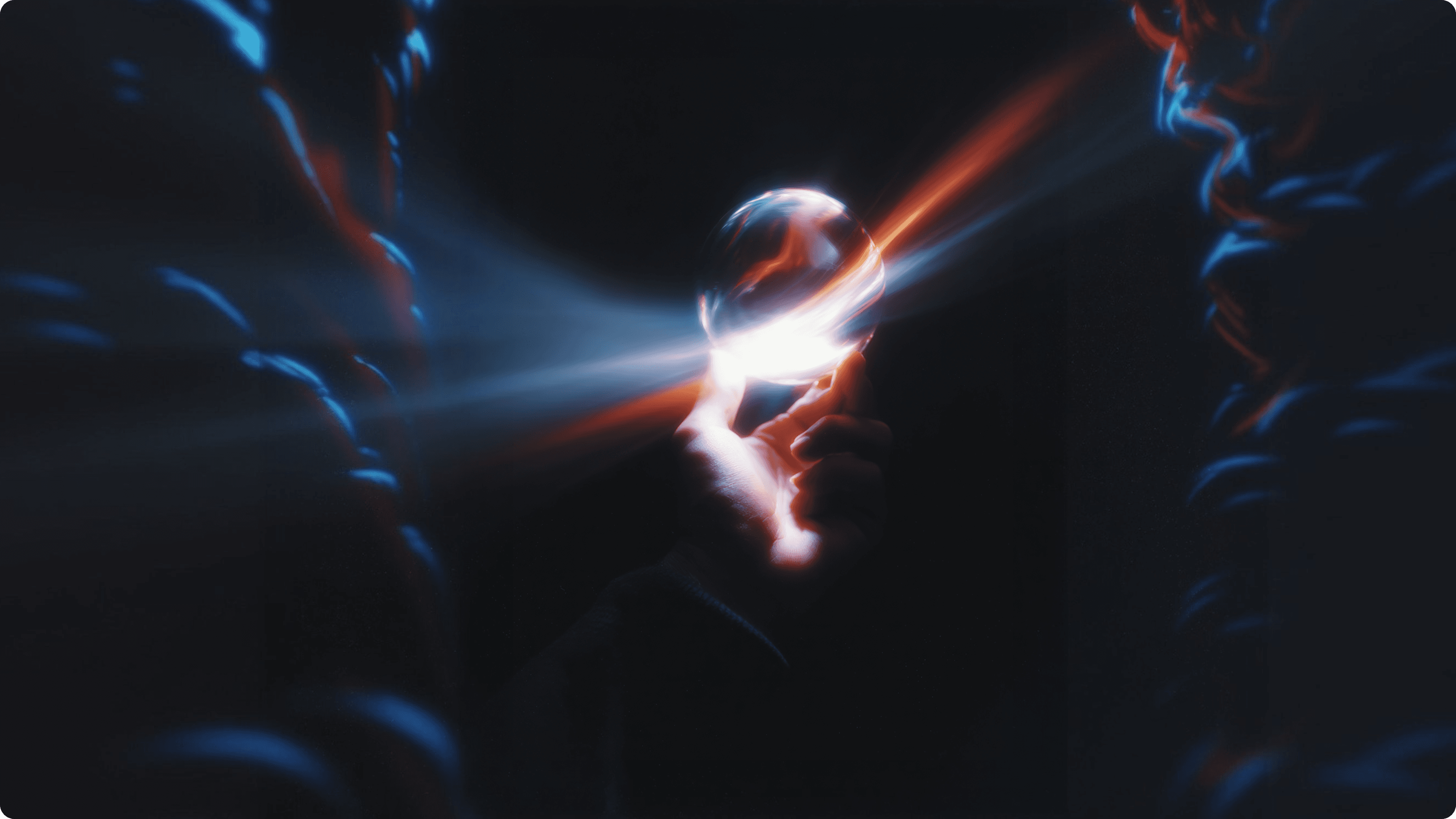 A cinematic close-up of a hand holding a glowing glass sphere with cosmic light beams, symbolizing the moment a founder's idea moves from the inner universe into a tangible design system by Luna UI.