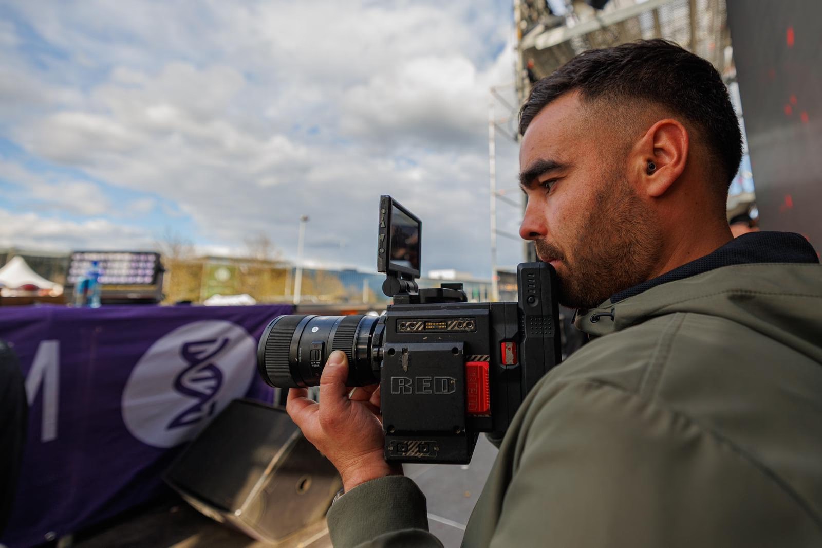 person shooting with a RED camera at a hardstyle festival