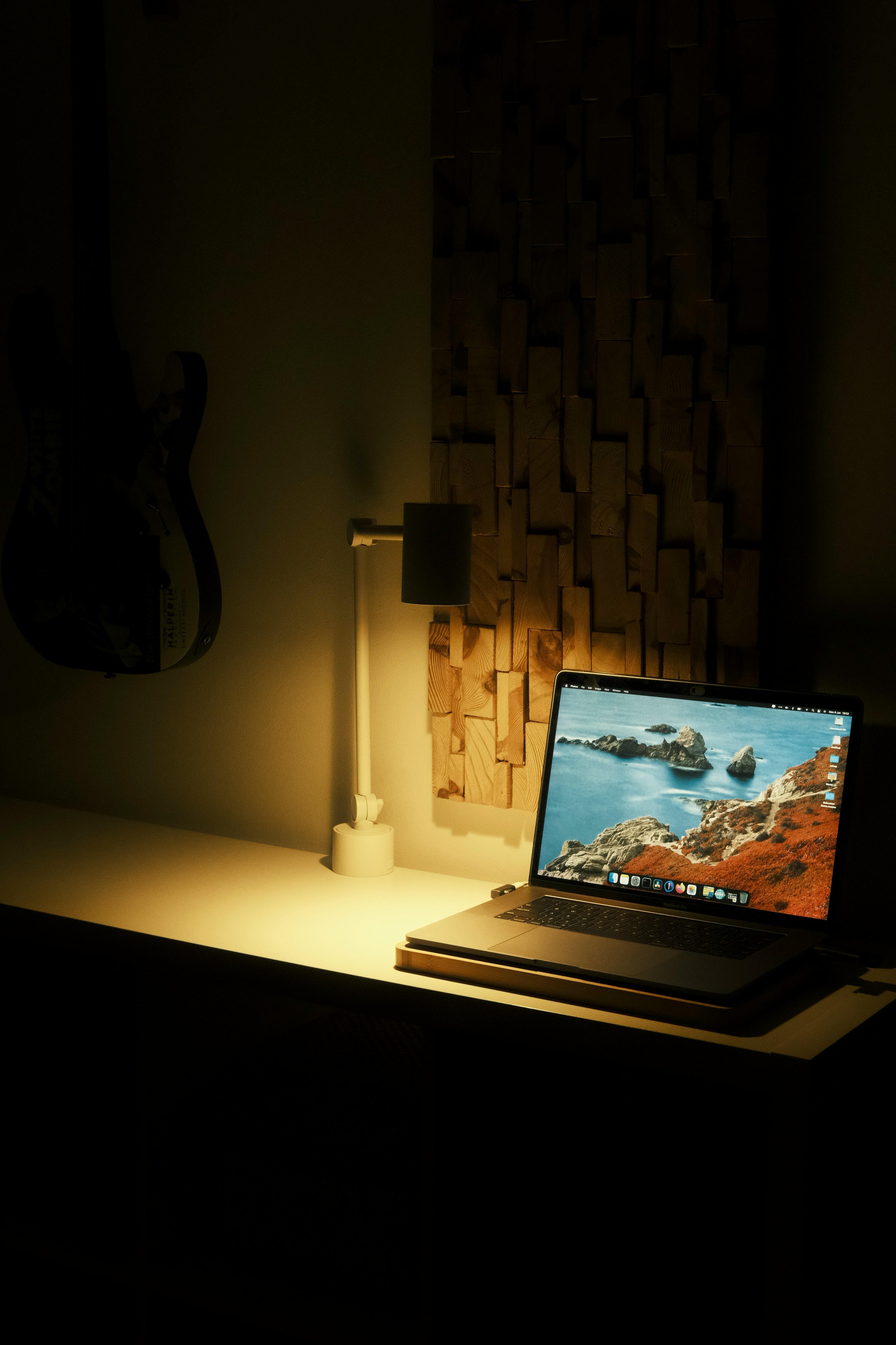 A laptop computer sitting on top of a desk