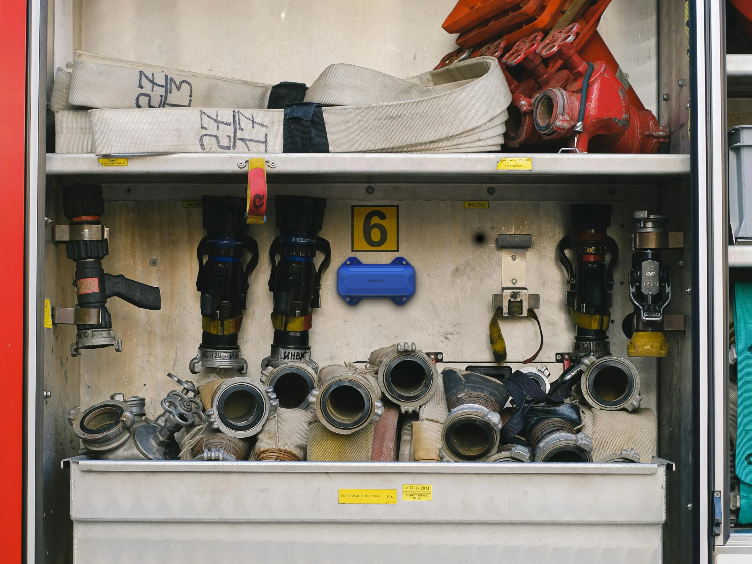 Velavu Dorado device installed in the compartment of a fire truck to track tags