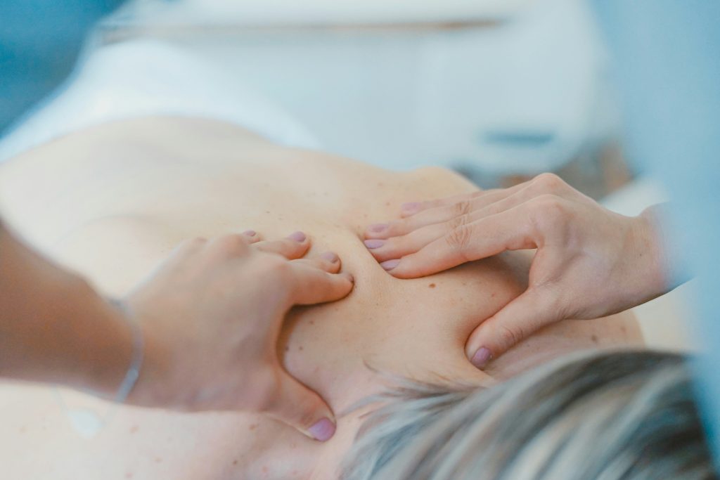 woman getting her neck massaged
