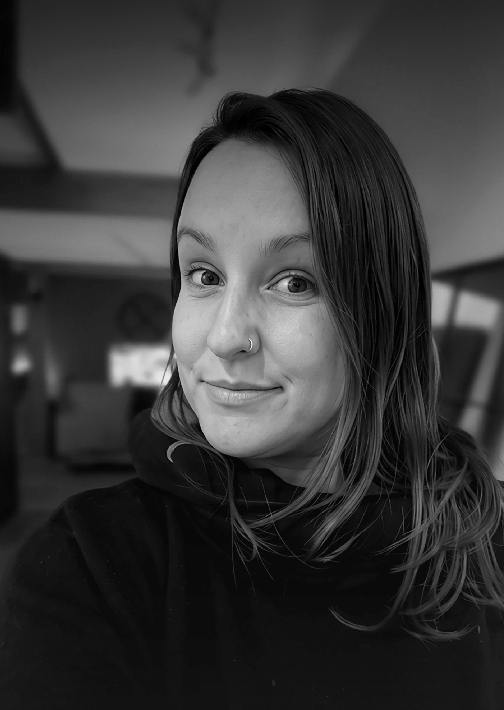 grayscale photo of woman in white and black stripe shirt