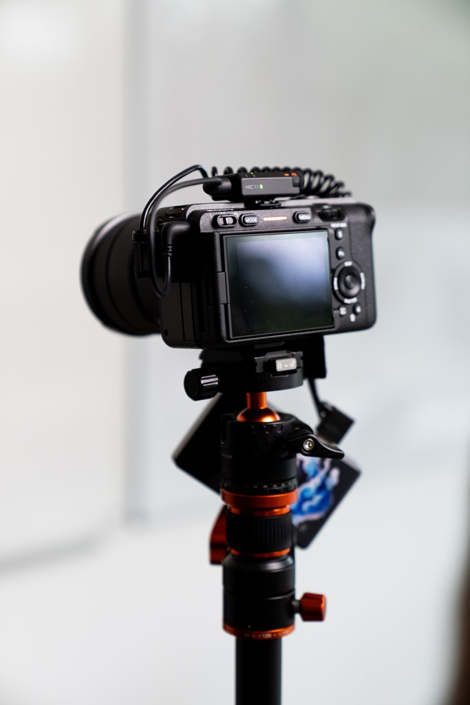 person holding black Sony DSLR camera