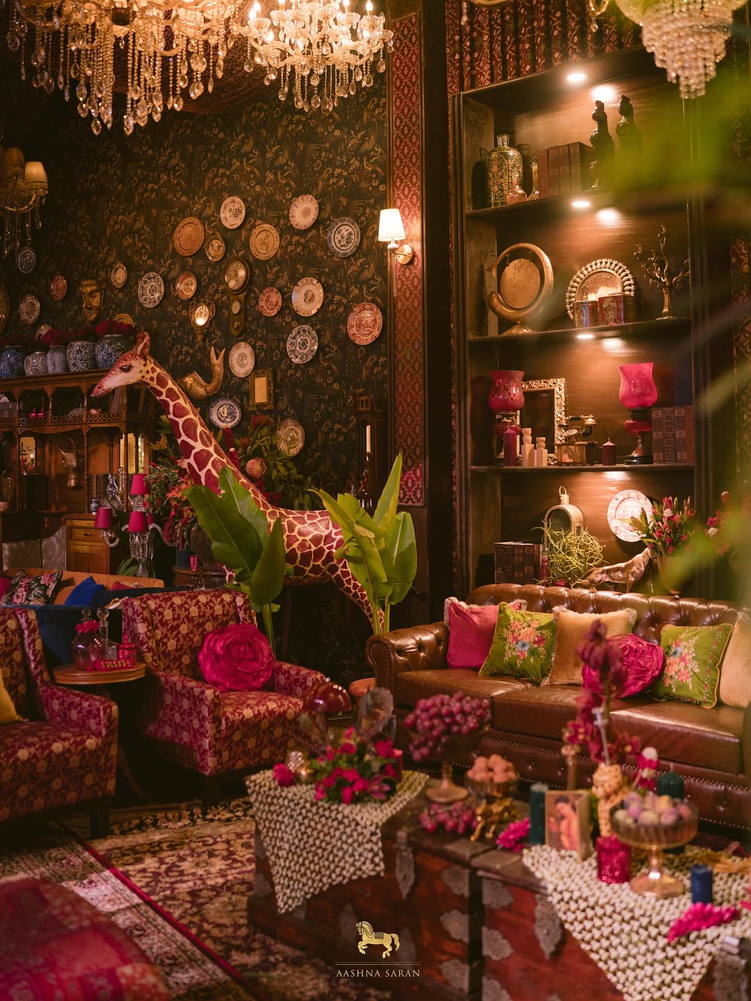 A man with long hair is working on a computer.