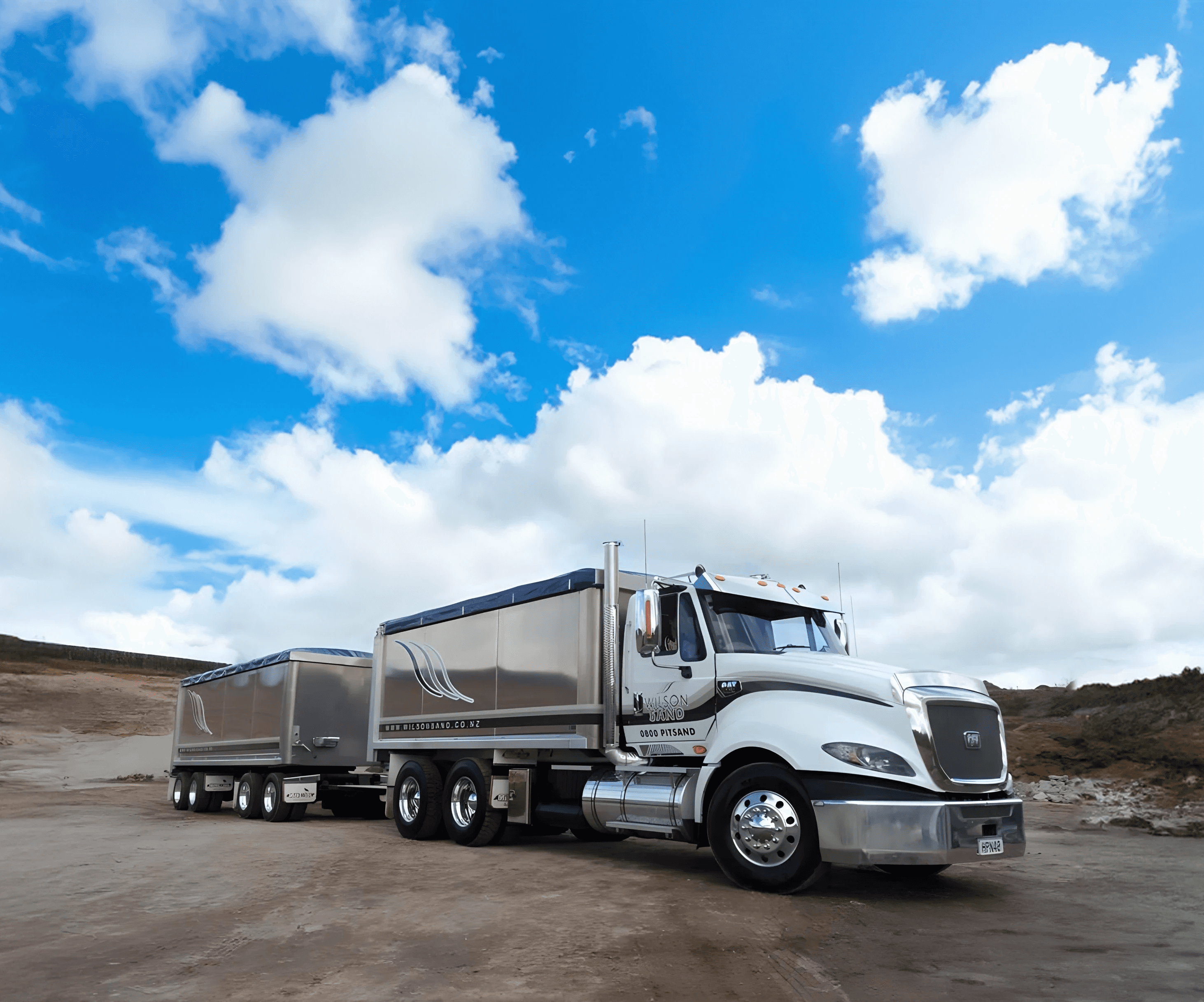 A Wilson Sand Truck in the middle of the sand quarry with a blue sky