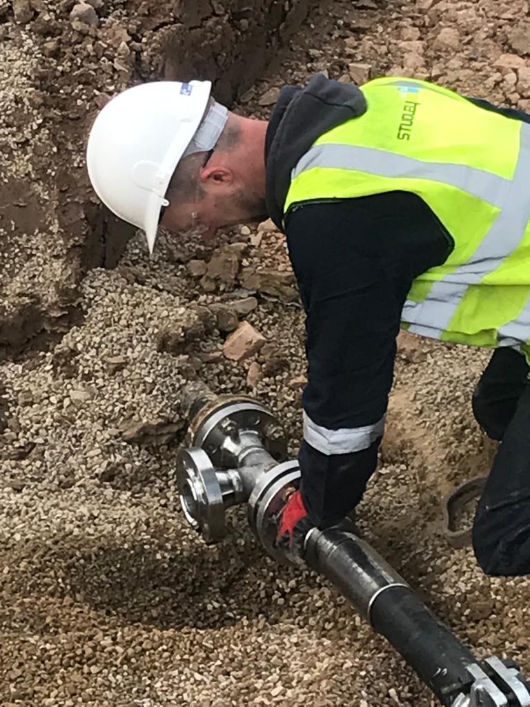 two men in suit sitting on sofa