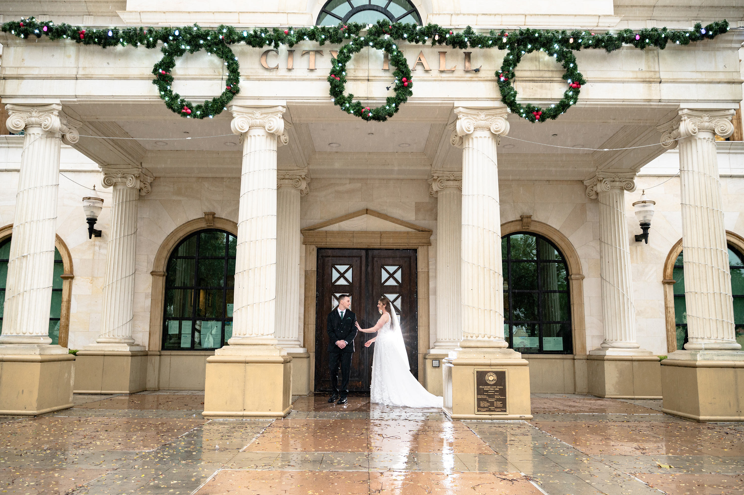 Flat lay wedding details with bouquet, rings, and sparkling bridal heels