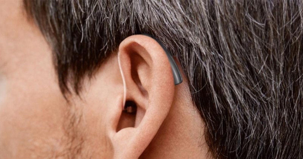 Old brick building with archways and windows.