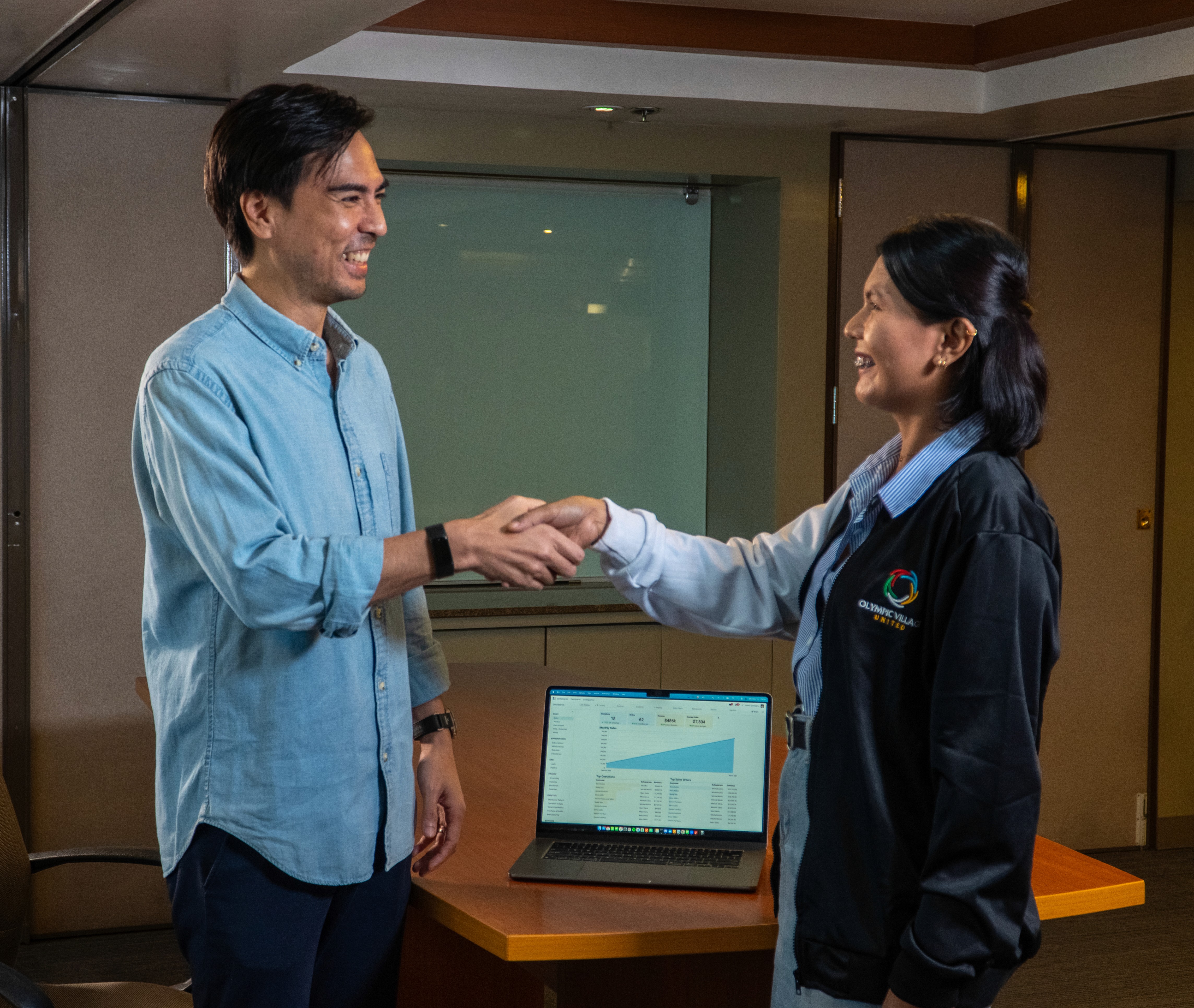 a group of children sitting on steps in front of a building