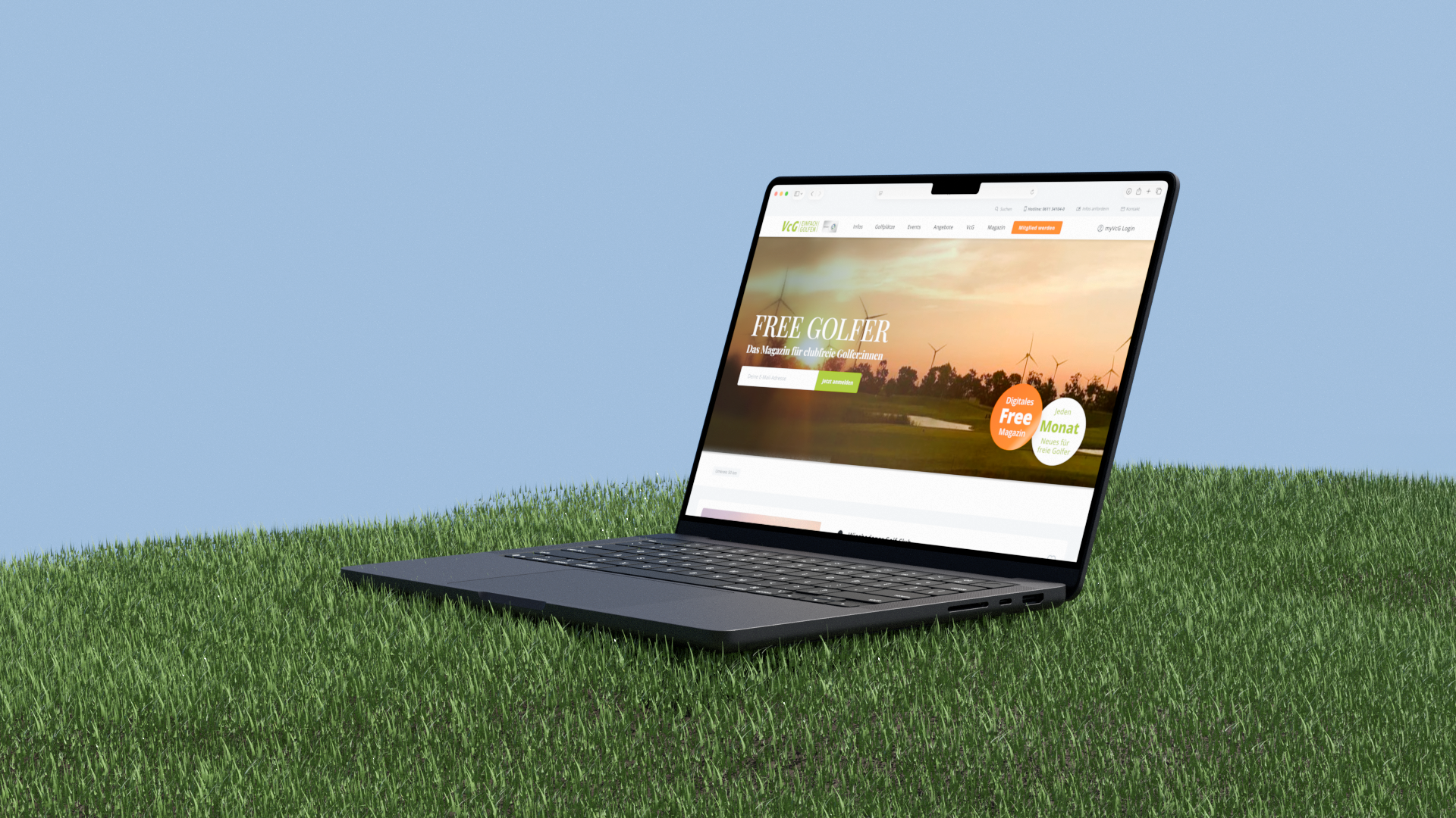 Ein Laptop, auf dem die VCG-Website angezeigt wird. Der Laptop steht auf einer Wiese.