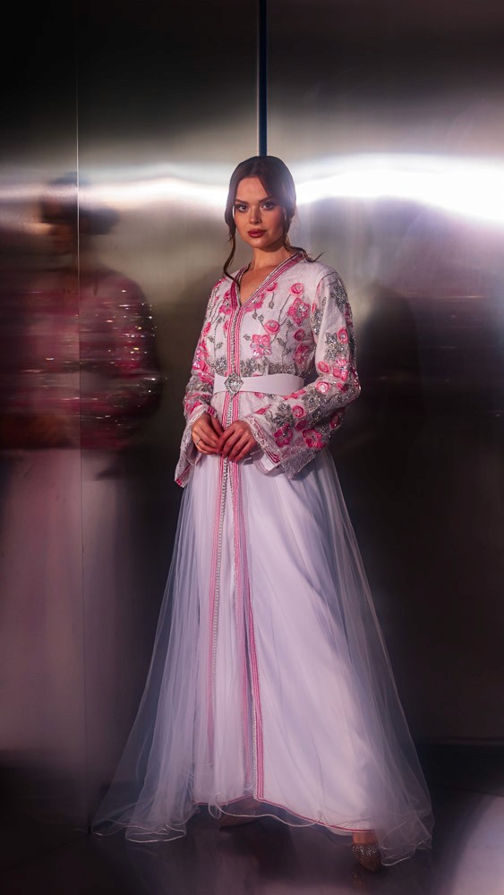 Blush pink Moroccan caftan with delicate embroidery, handcrafted luxury design for refined occasions in Bahrain