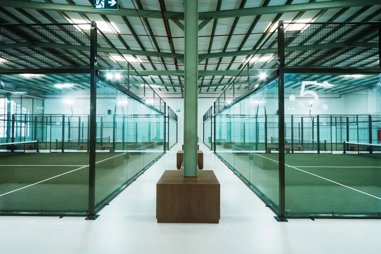 a group of people in a room with a projector screen
