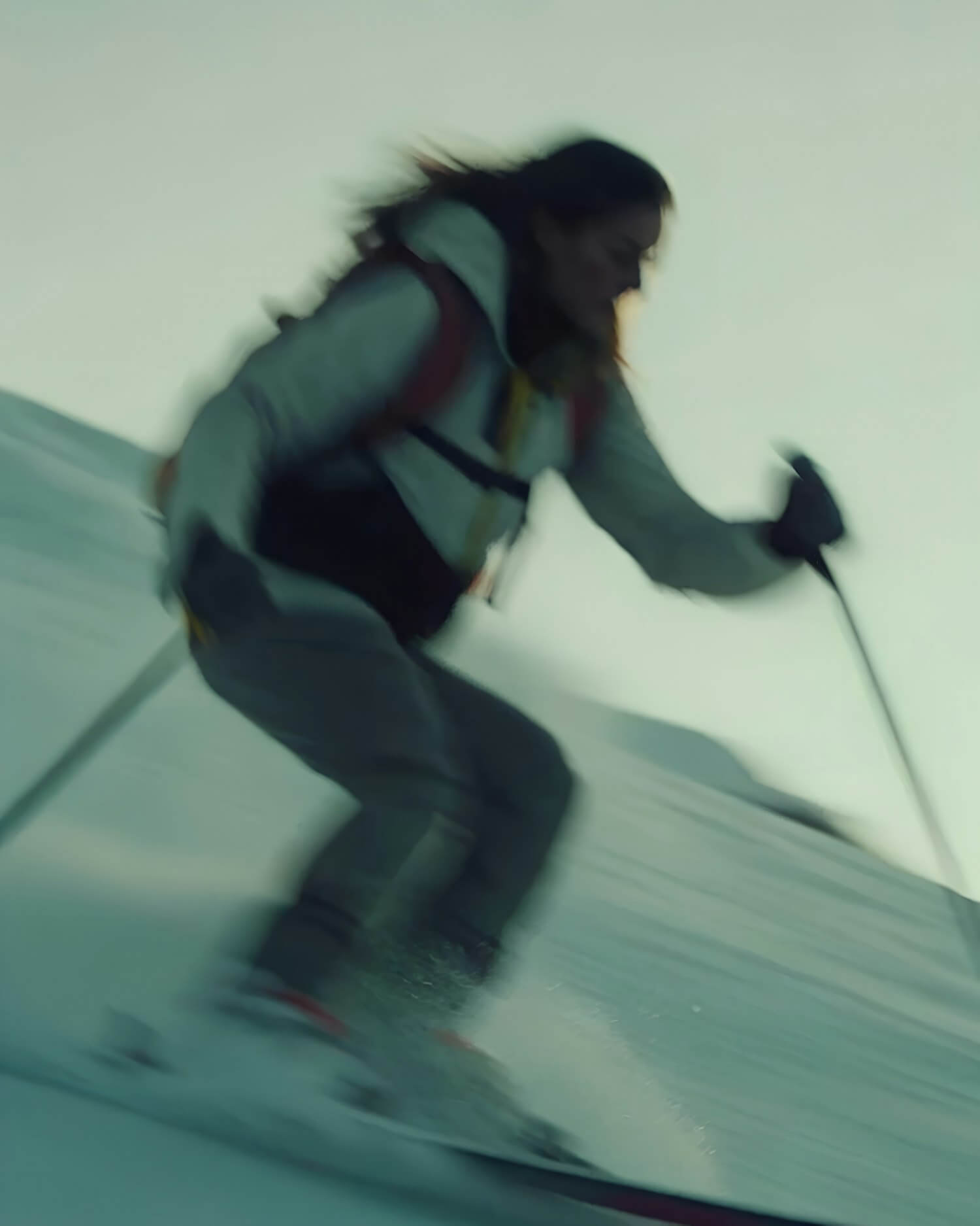 Skier in motion carving through snow at speed
