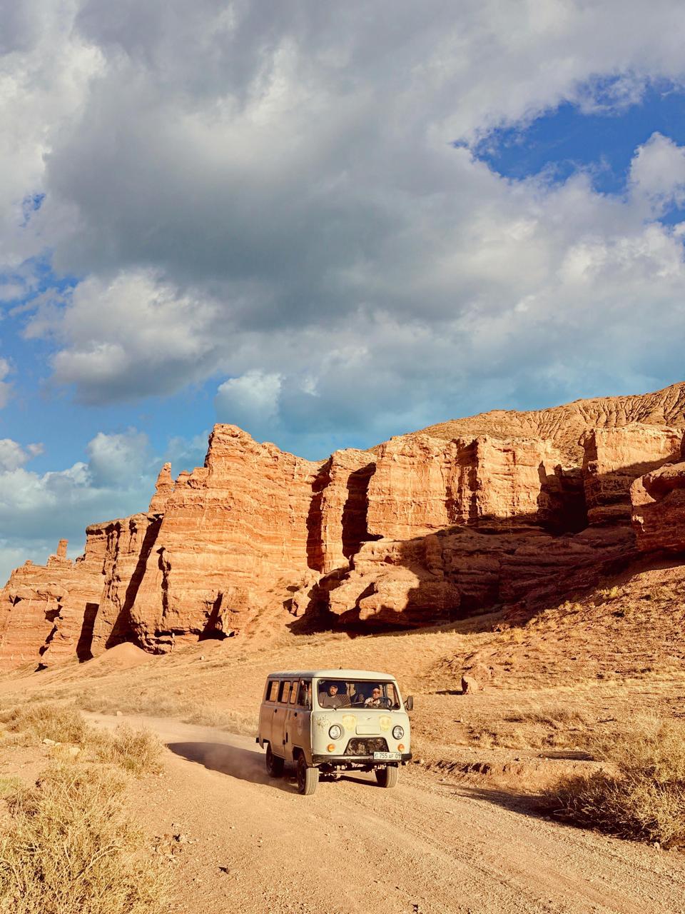 photo of brown bench near swimming pool