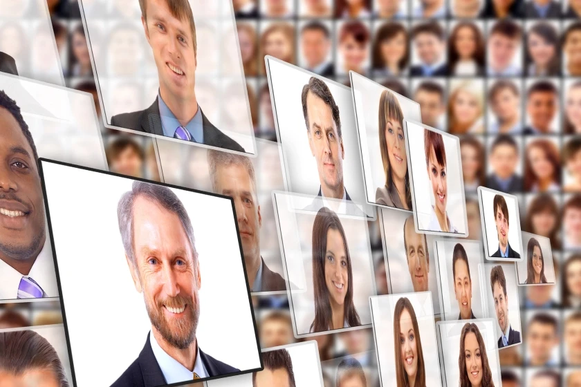 A grid of multiple portraits of people, with some images in the foreground appearing to float on a higher level. The prominent image on the left shows a smiling middle-aged man. In the center, another man is smiling, and in the top right, there is a portrait of a woman looking forward. The background images are blurred and create a sense of depth.