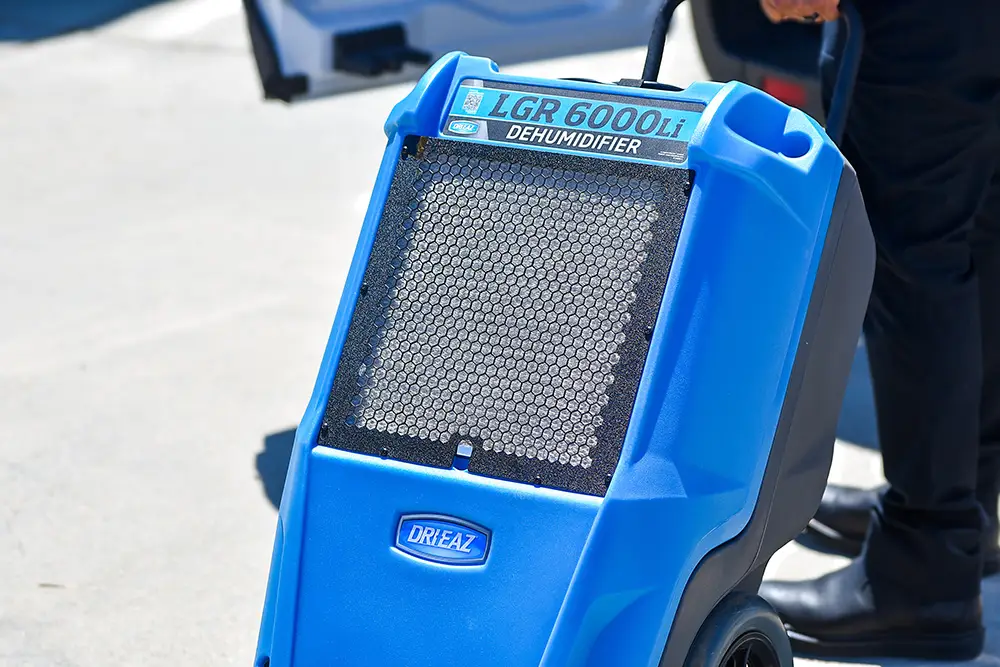 Close-up of a Dri-Eaz LGR 6000Li commercial dehumidifier used by NewGen Restoration for water damage cleanup in San Diego.