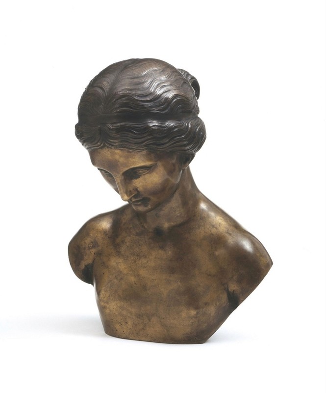 Minimalist living space featuring oak flooring, timber wall panels and panoramic windows with natural light.