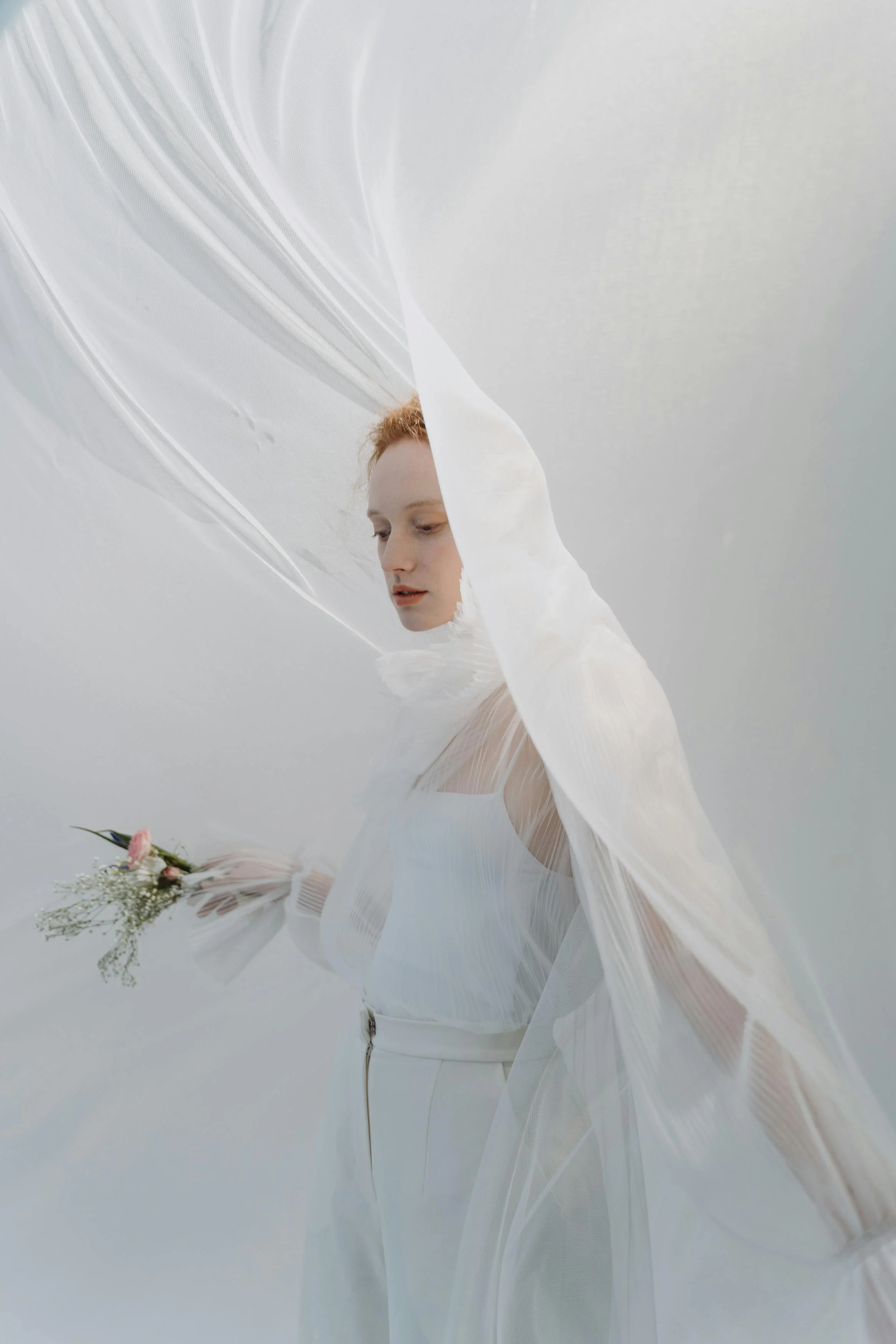 Eleanor Hastings pose with flowers and sheets