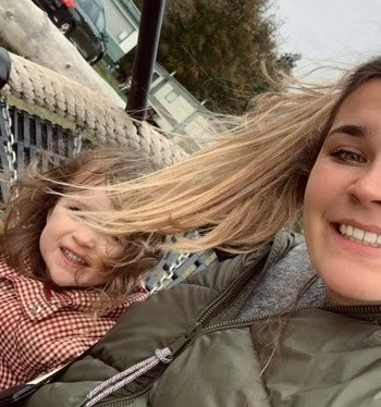 Babysitter Angel Iris with the child she is babysitting