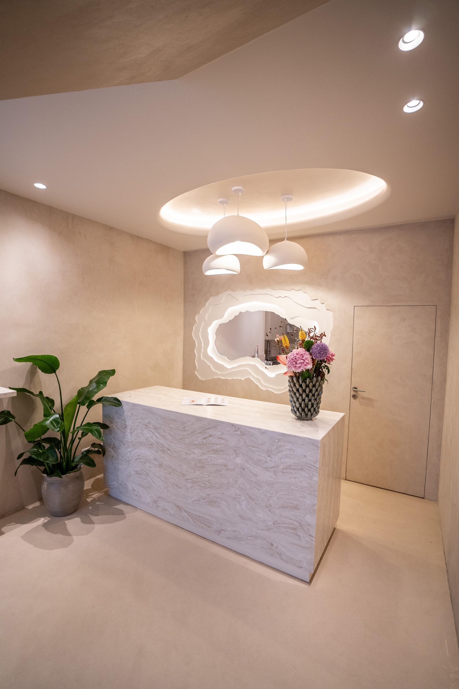 Layered latte in glass with flowers and plants