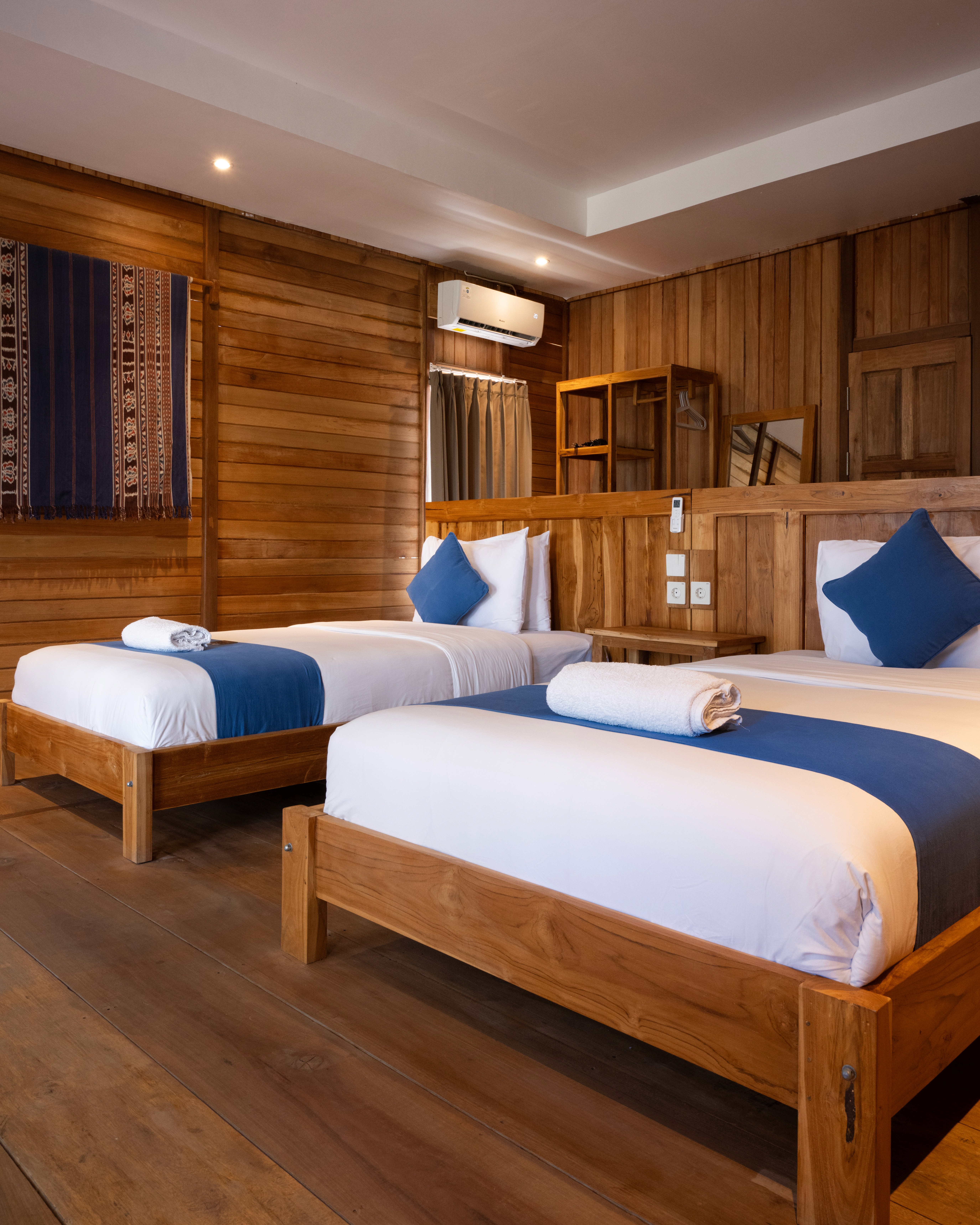 a bed room with two beds and a table