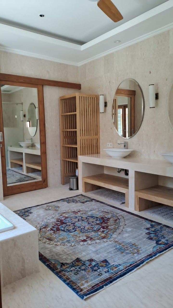 A 4-bedroom villa in a gated complex in Nusa Dua, featuring a large private garden and a peaceful residential environment