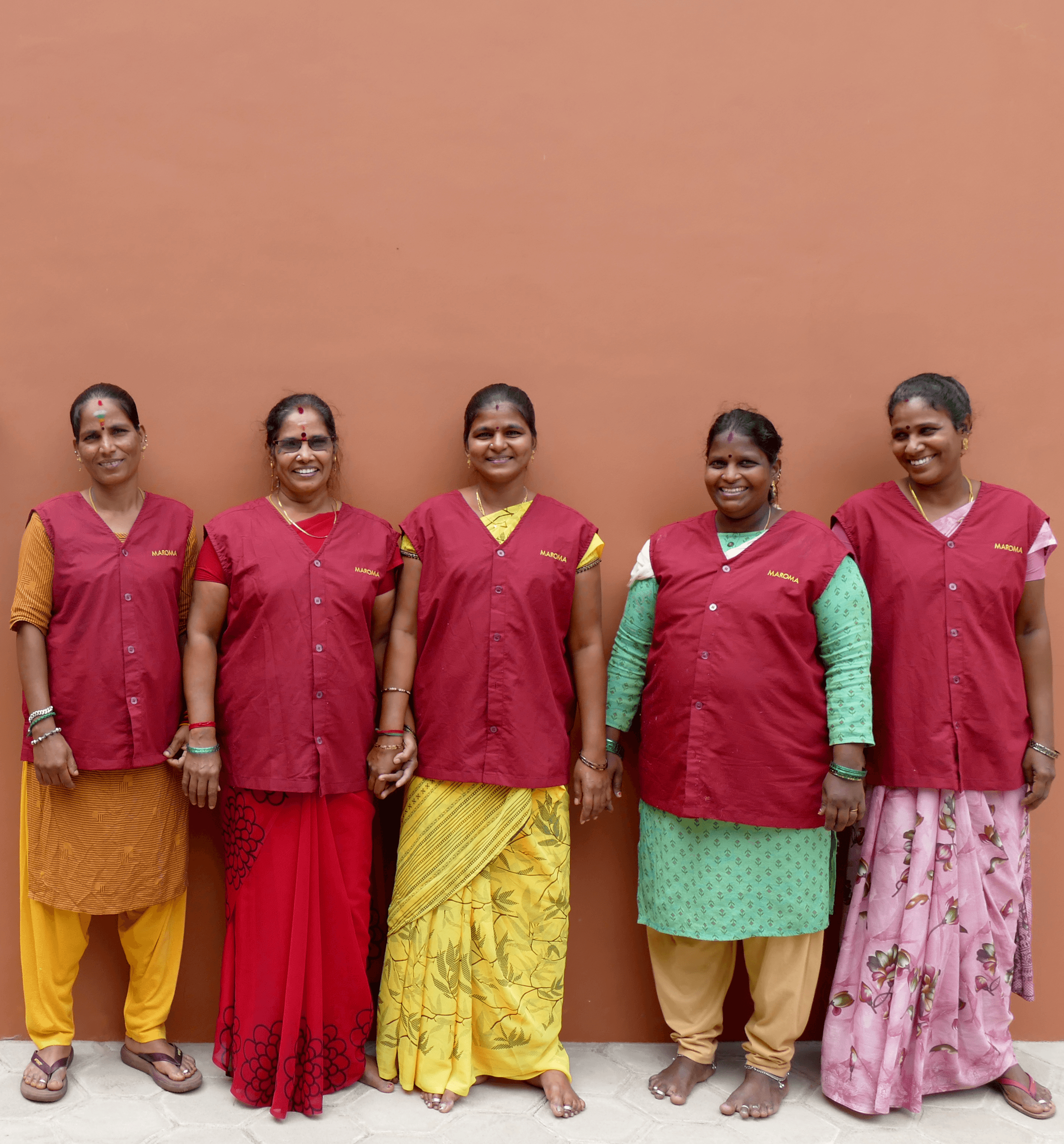 A woman lying down on a soft surface with her eyes closed, bathed in warm sunlight filtering through leaves. Her face has a natural glow, reflecting relaxation and tranquility in a serene spa-like setting.