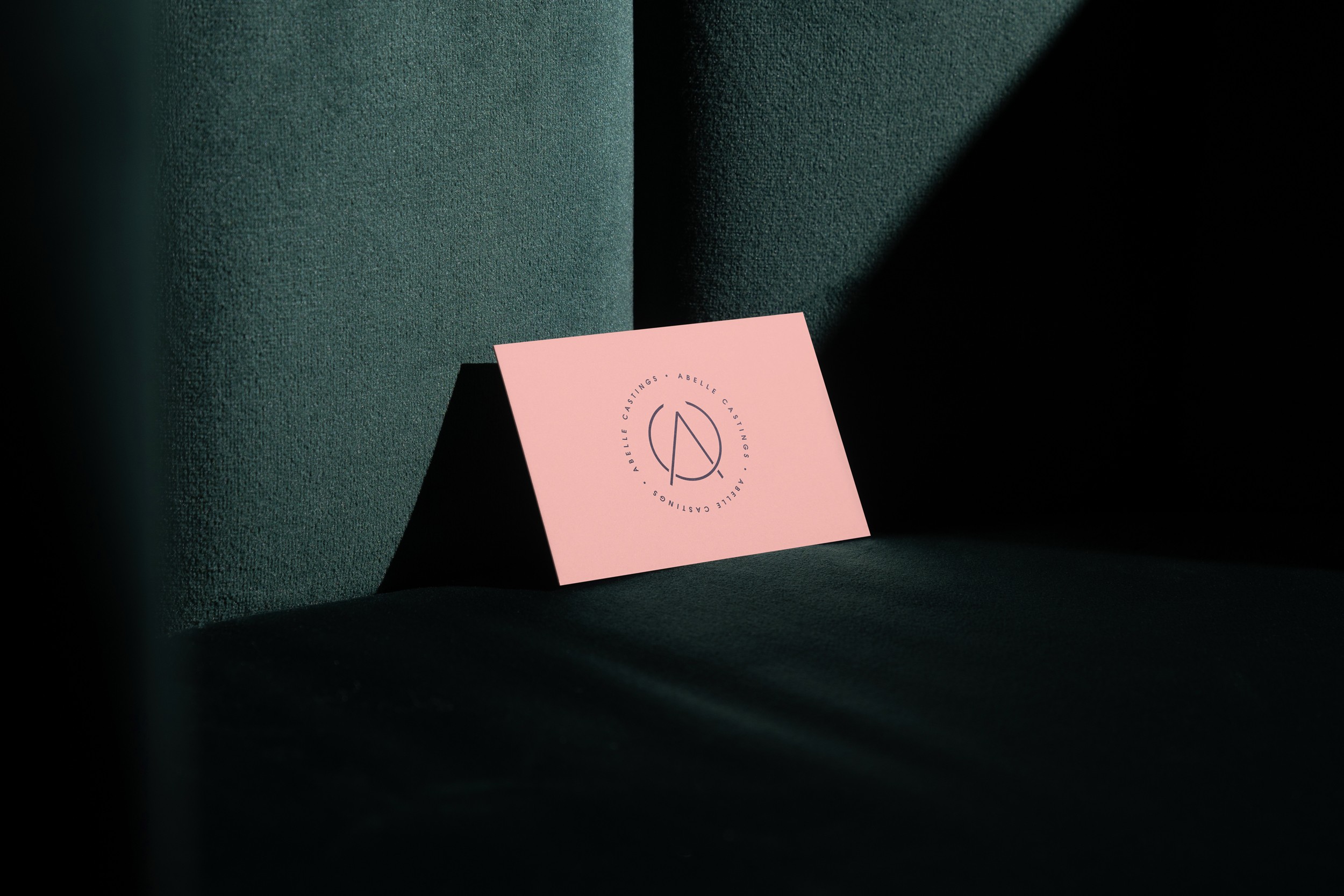 Abelle Castings logo on pink business card