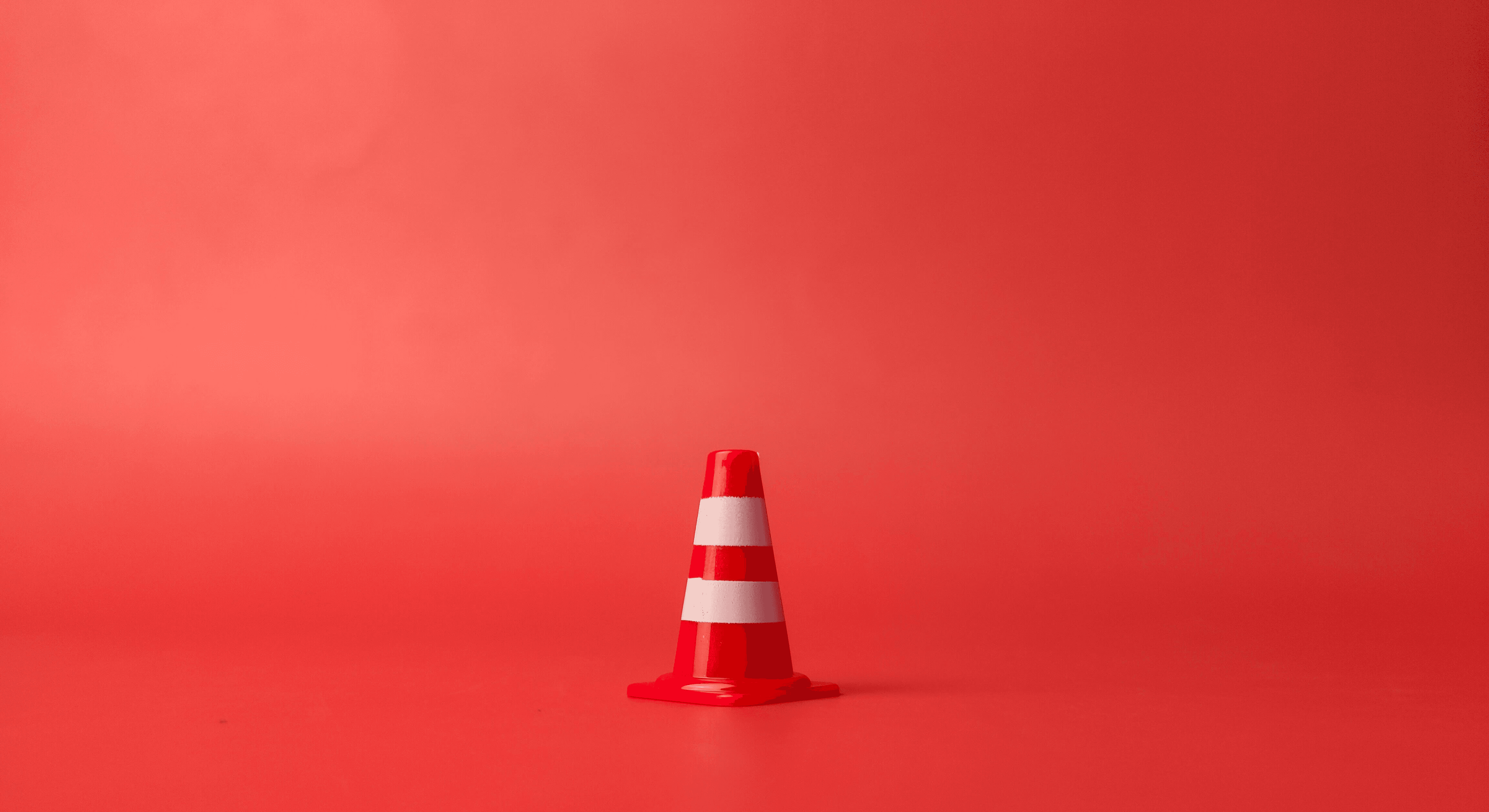 red flag on pole under blue sky during daytime