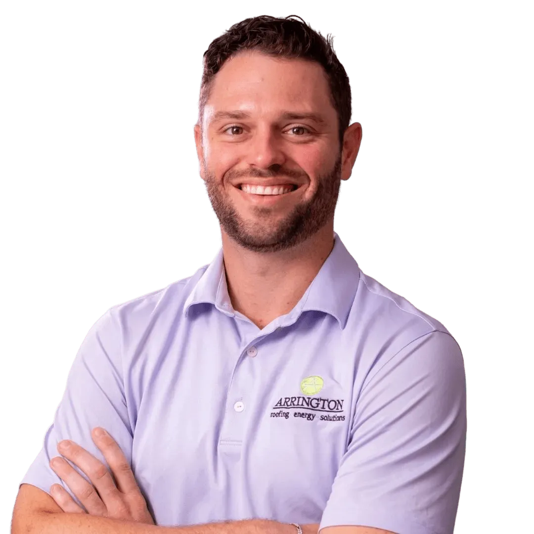 Arrington Roofing & Energy Solutions employee smiles with crossed arms
