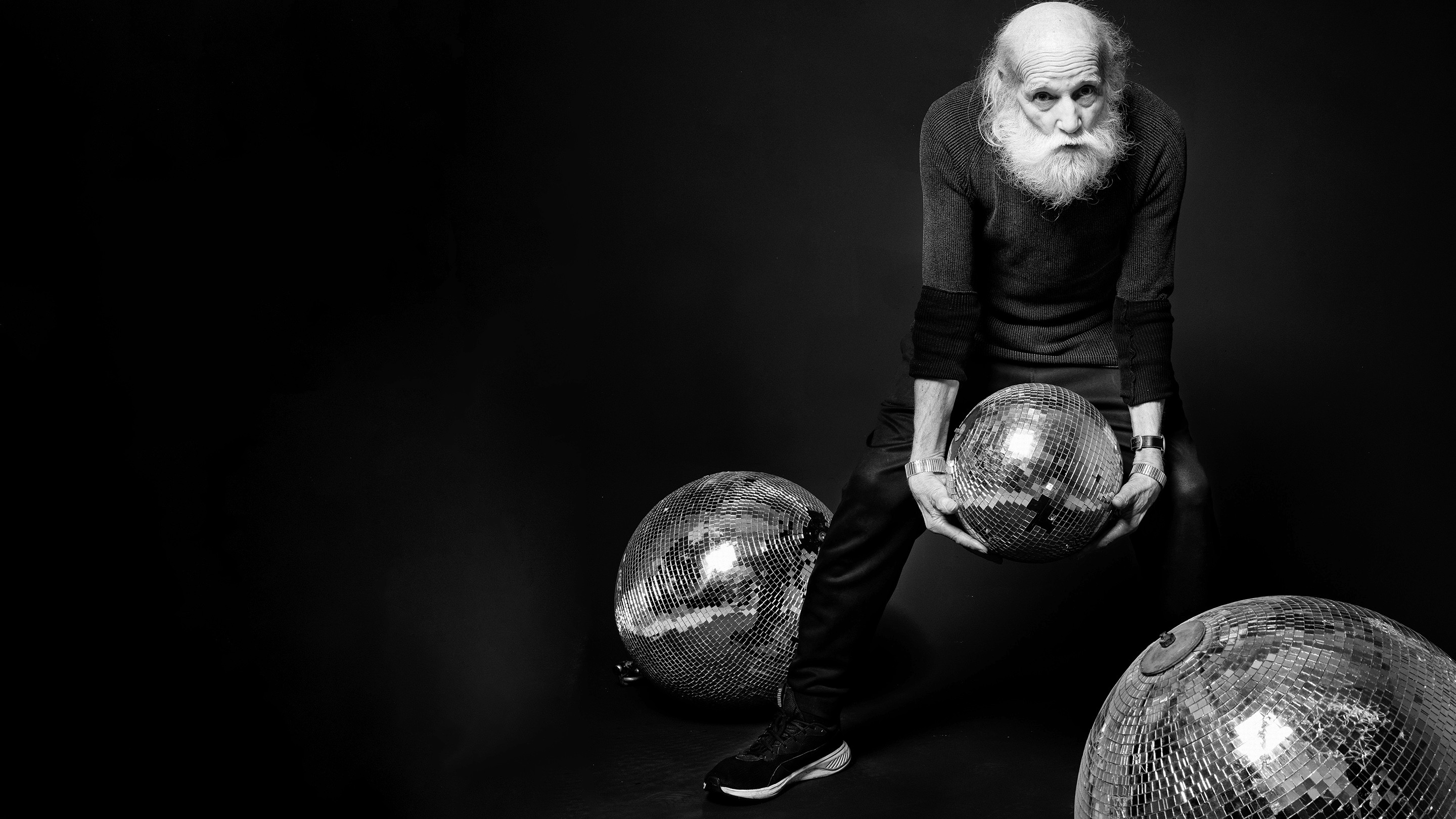 Old man with disco balls