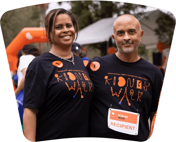Two people in Kidney Walk T-shirts at a walk event.