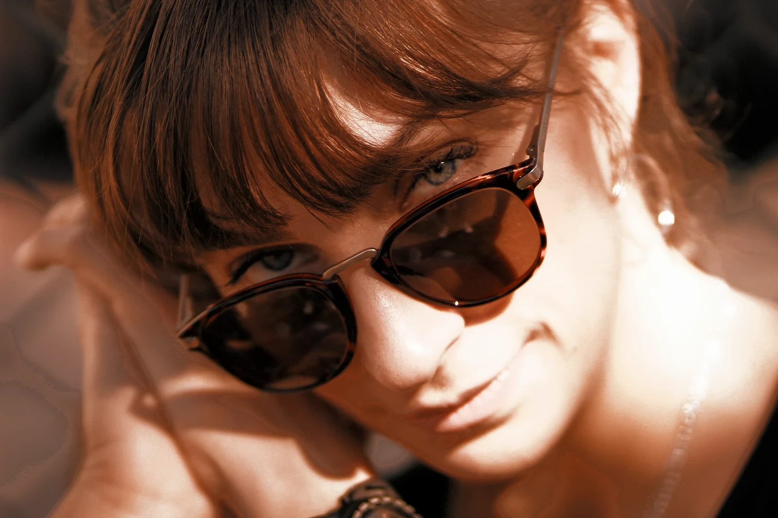 A woman in tortoiseshell sunglasses