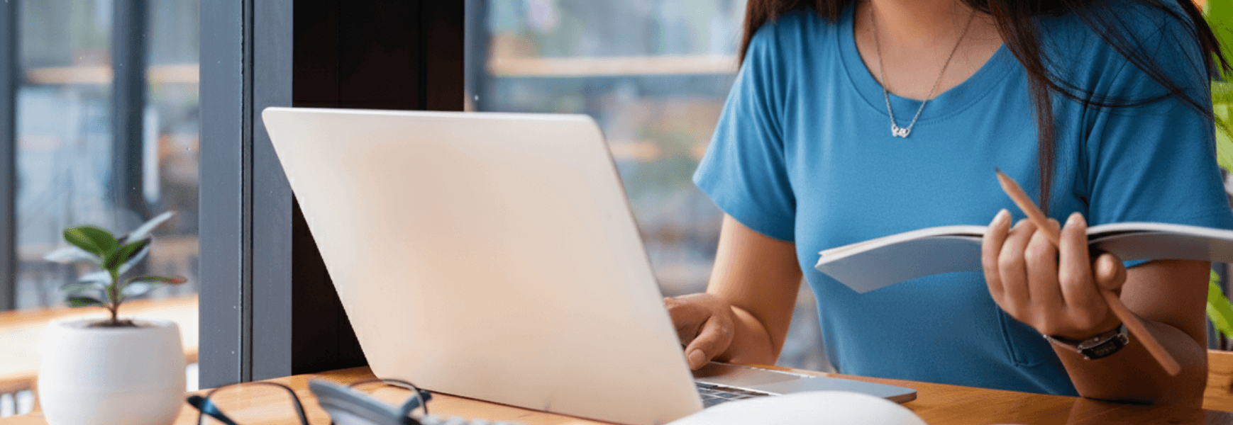 man standing in front of people sitting beside table with laptop computers