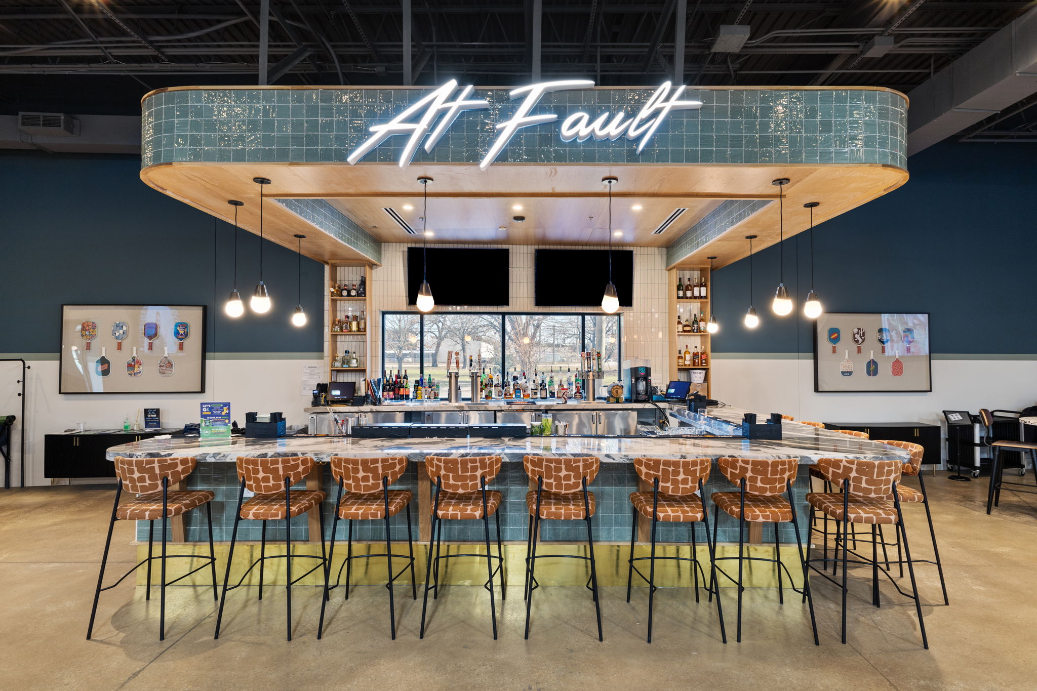 Custom front-lit At Fault bar signage designed for a high-energy indoor pickleball venue in Dallas, Texas.