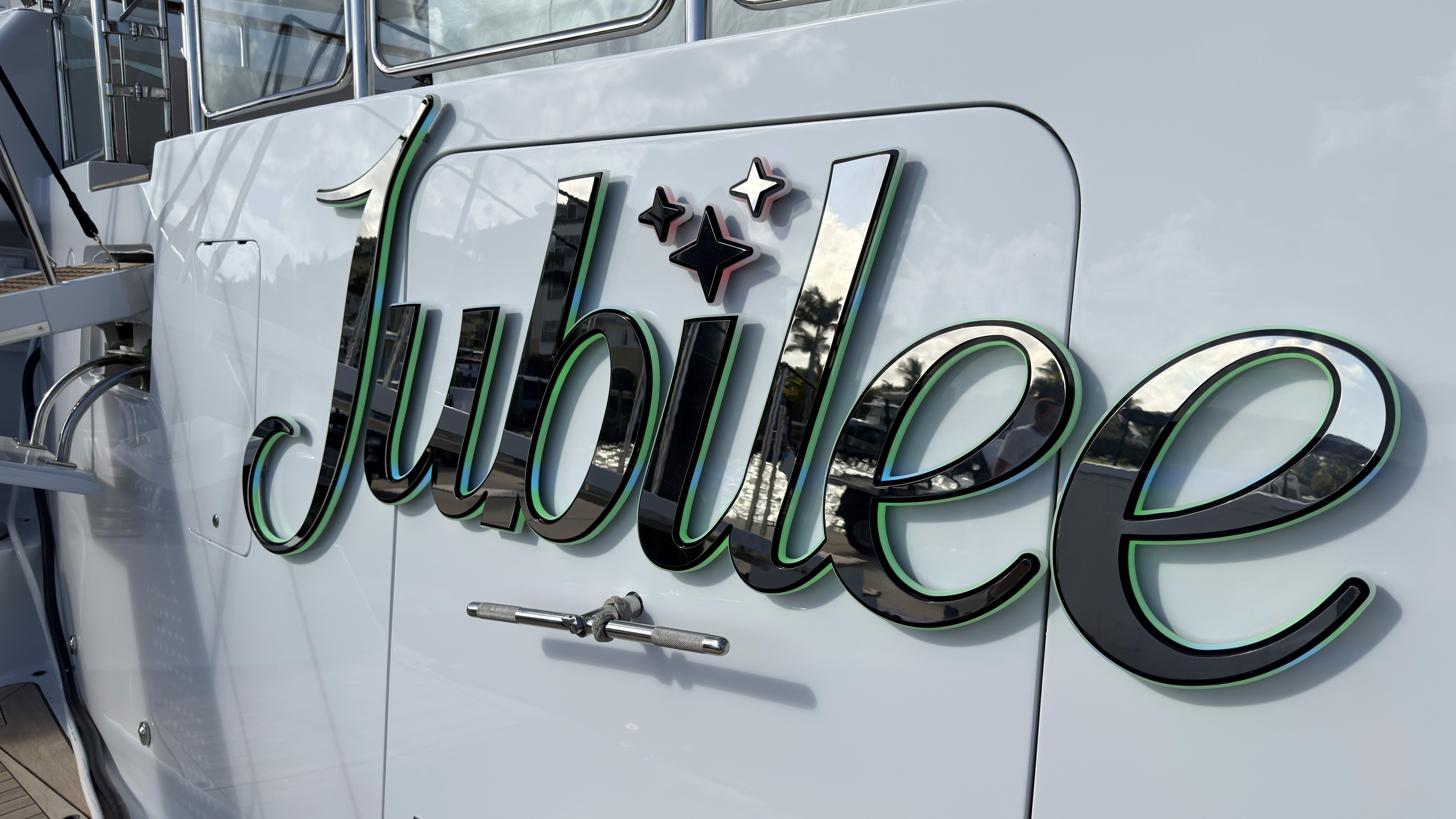3D chrome and green illuminated yacht name Jubilee