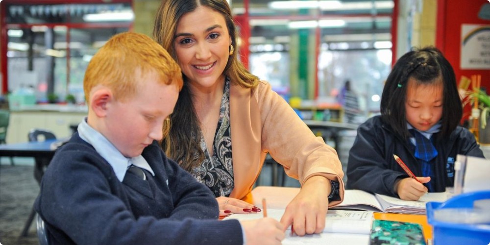a teacher helping a pupil