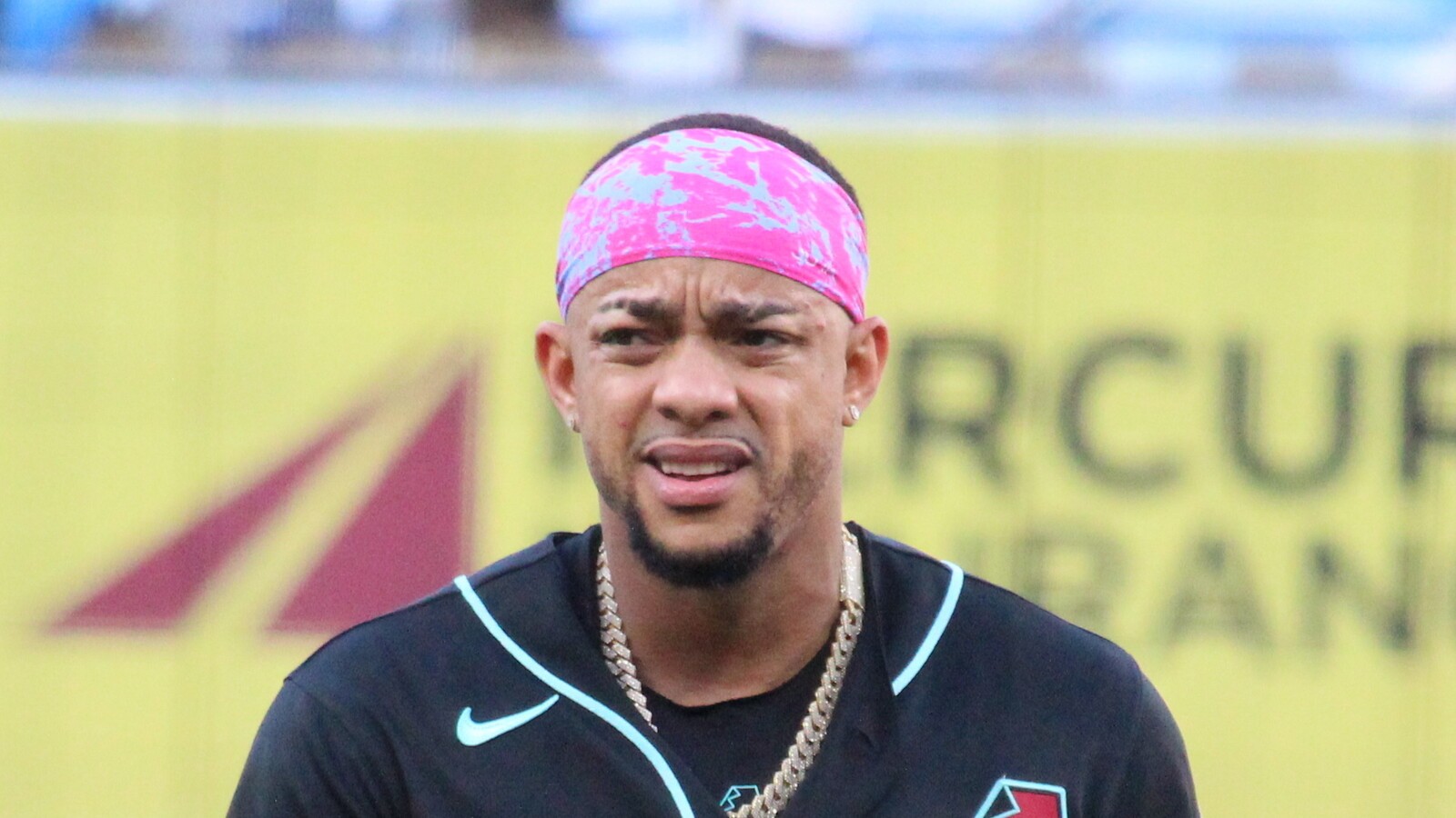 Close-up of Ketel Marte in an Arizona Diamondbacks black jersey and pink headband, face clearly visible