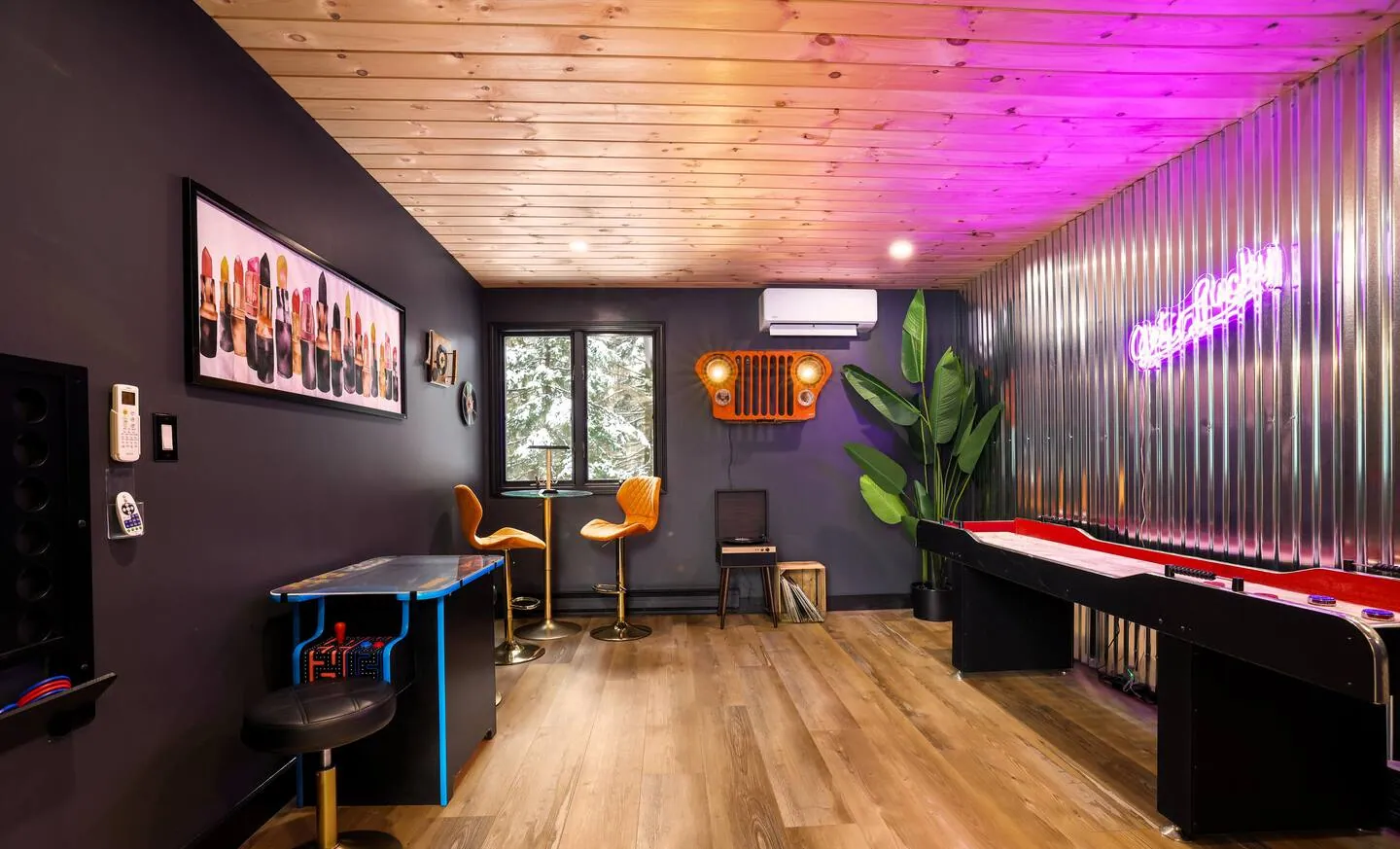 Game room with shuffleboard, arcade table, giant Connect 4 and bar stools at Get Lucky On Lupine