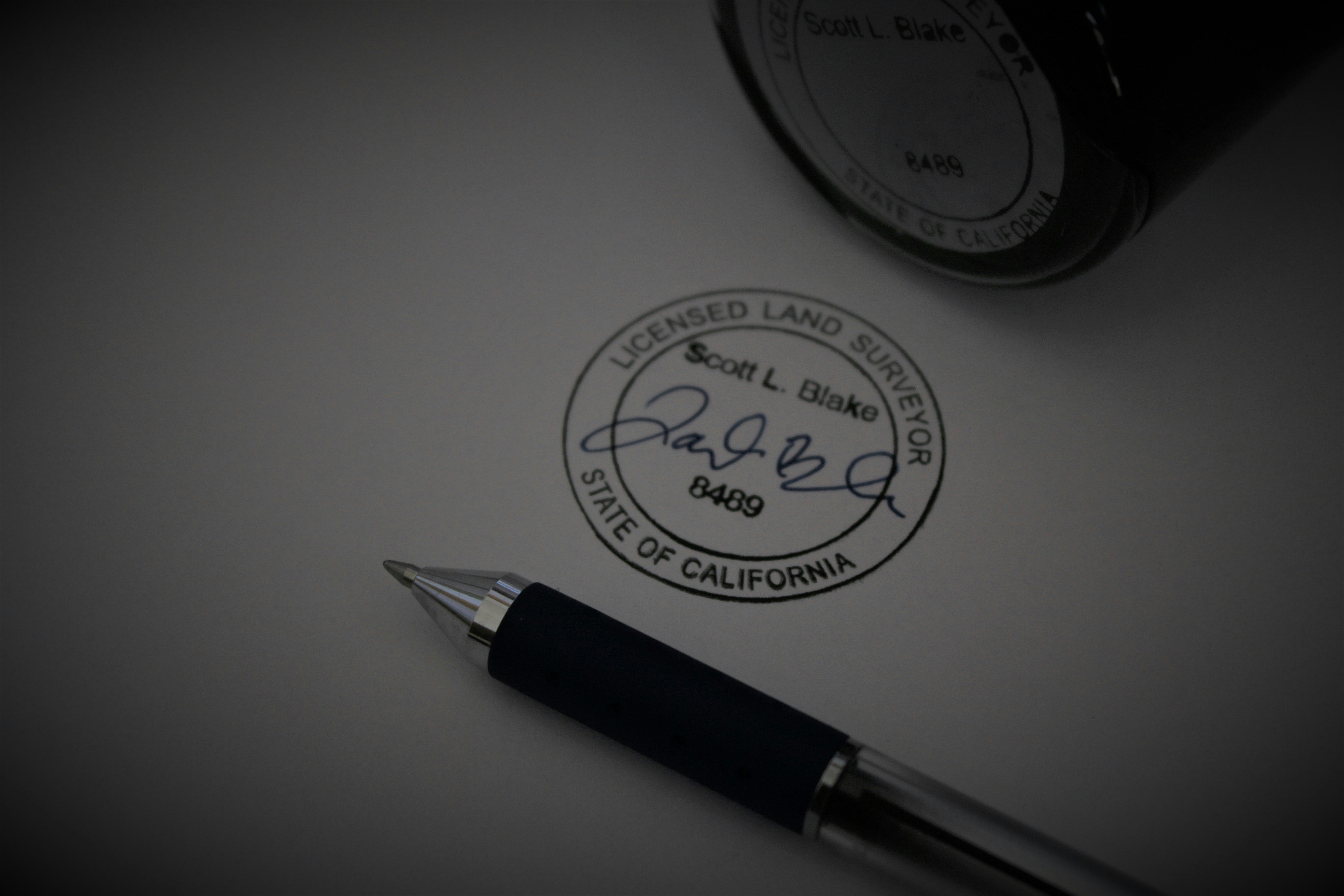 a pen sitting on top of a piece of paper