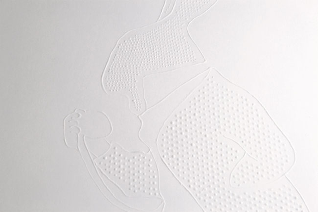 A white surface features a raised, textured pattern resembling a three-dimensional design. The pattern consists of small, closely spaced dots or bumps arranged in a grid-like formation. Curved lines and shapes are etched into the surface, creating a sense of depth and dimension. The background is a plain, light gray or off-white color, providing a neutral contrast to the white design.