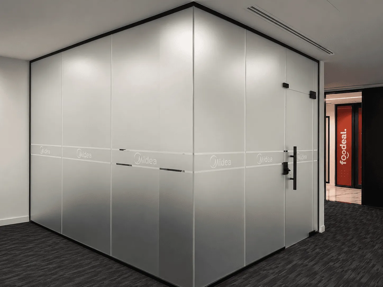 Midea frosted glass meeting room with subtle branded privacy film