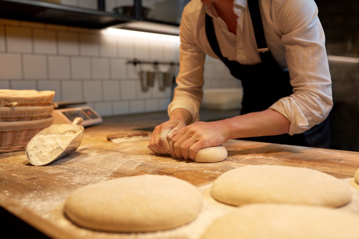 Bakery staff preparing dough for bread and pastries