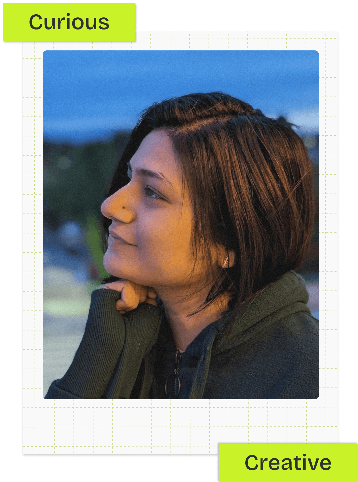 Person wearing a blue puffer jacket and red backpack standing in front of a light blue building on a city street.