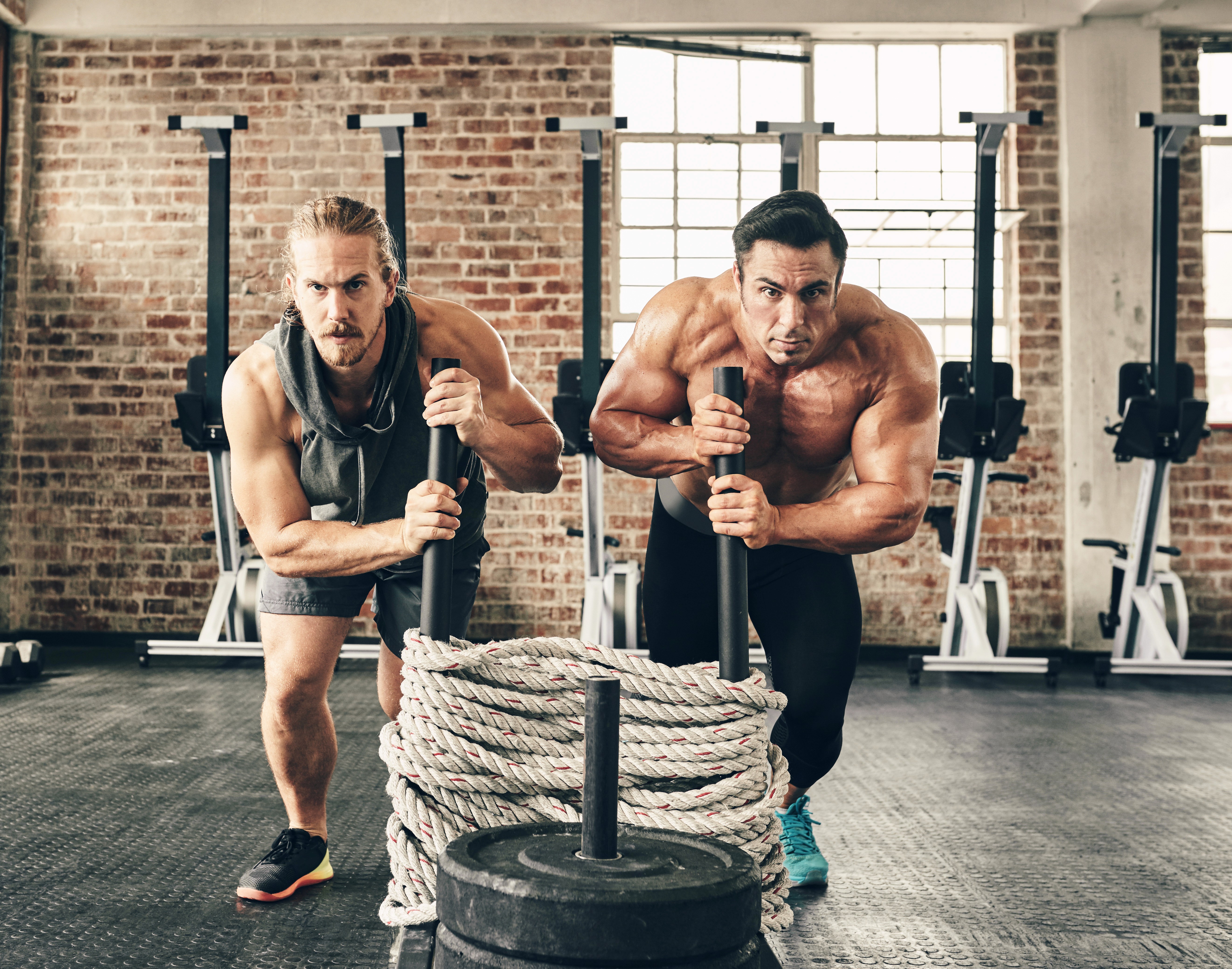 Man training in the gym and focusing on form — building lasting strength with Chasing Gains