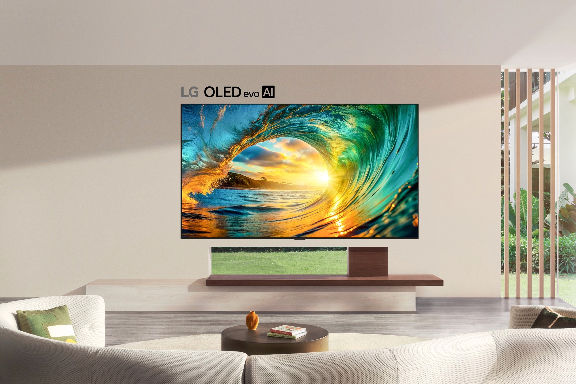 LG OLED TV with Kardome voice AI wall-mounted TV in a modern living room, displaying a vivid ocean wave scene with ‘LG OLED evo AI’ branding above the screen.