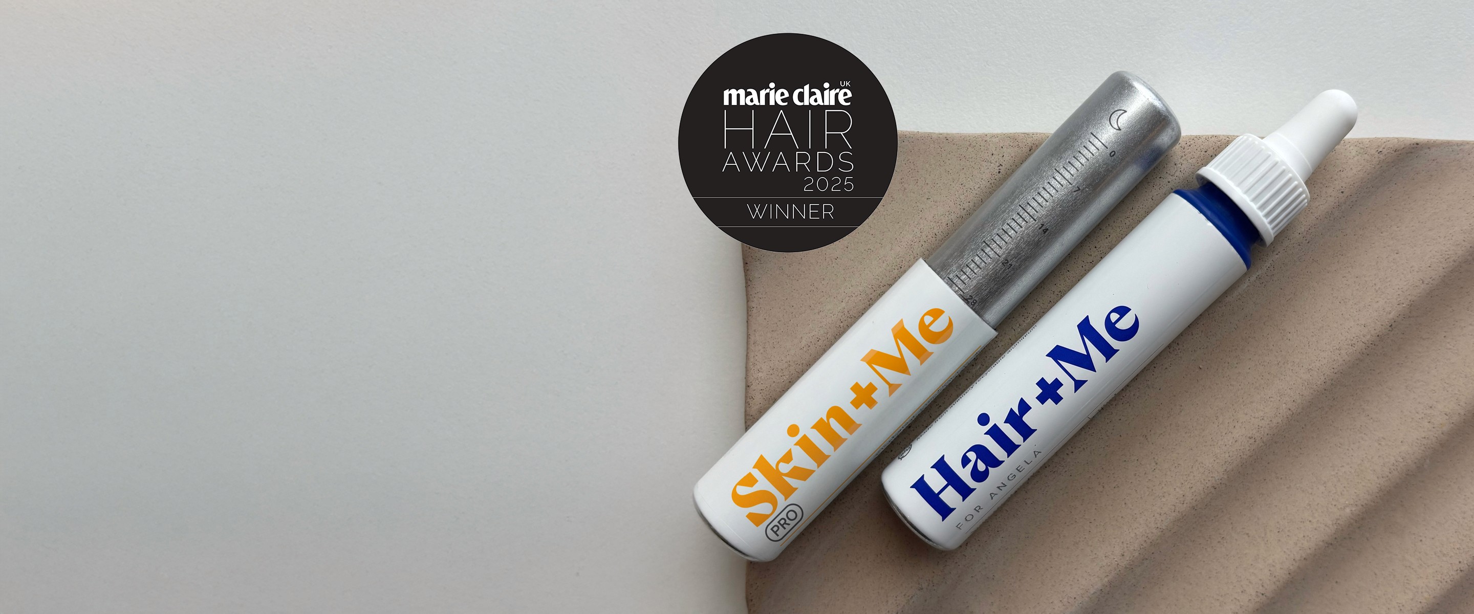 Image with products, The Capsules and The Drops dispayed with a pillow box. There is also a "featured in vogue" badge.