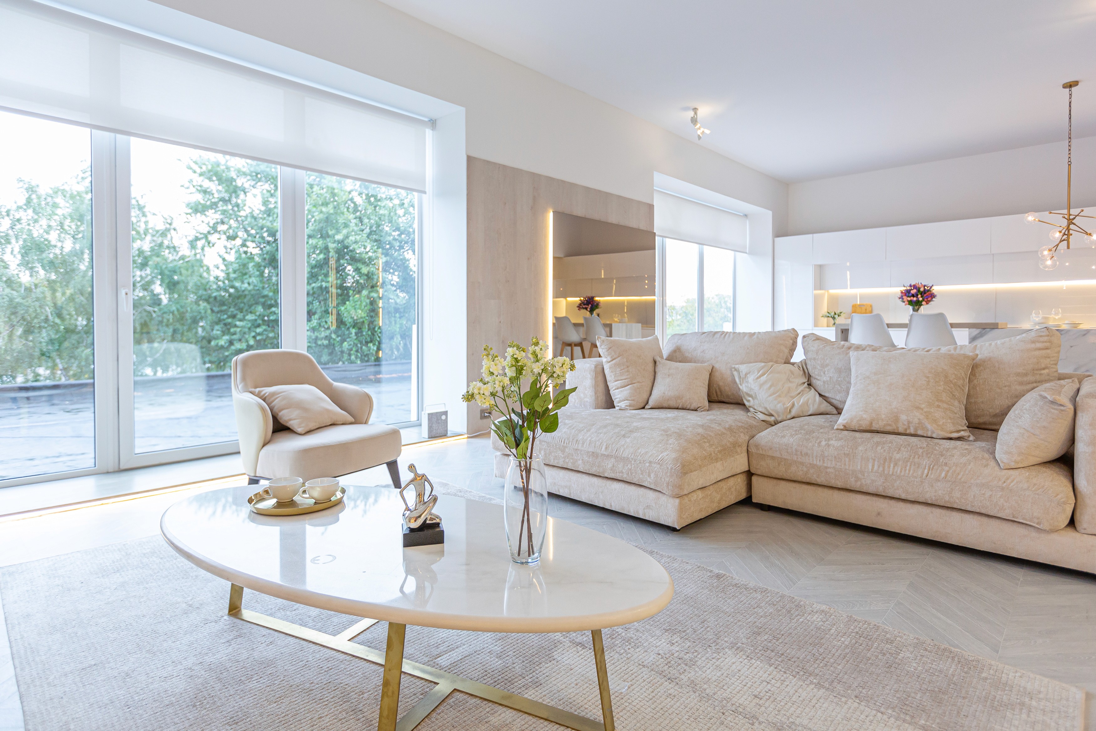 woman sitting around table holding tablet